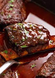 beef ribs in bbq sauce slow cooked