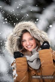 Robinhood has applied to trade its stock under the ticker symbol hood on nasdaq global select market. Young Woman Wearing Fur Hood In Snow Fall Portrait Cheerful Winter Stock Photo 173592318