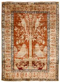 a silk heriz rug with tree of life