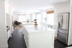 white kitchen with dark wood floors