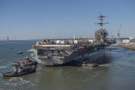 us navy aircraft carrier leaves drydock