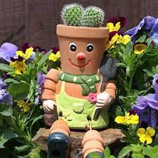 terracotta flower pot man planter