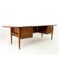 If your work involves a desktop, then an executive desk. Standard Furniture Mid Century Walnut Executive Desk