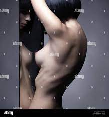 Elegant beautiful nude woman with perfect sexy body. Naked elegant lady  pose in studio. Art photography of nude sexy woman Stock Photo - Alamy