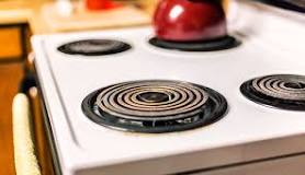 How do you clean a burnt stove plate?