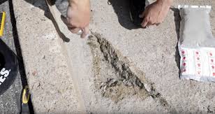 how to repair concrete holes make it