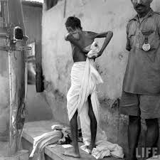 A famine affected man changing his cloth | Sardar Vallabhbhai Patel