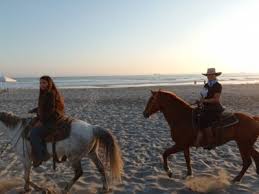 horseback riding on the beach in