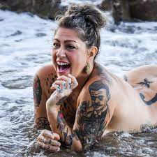 American Pickers' Danielle Colby poses completely naked at beach and shows  off her massive tattoos for sexy new photo 