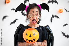 cute asian child wearing halloween