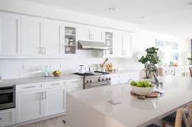 I honestly don't see what the draw is to stainless steel appliances. Contemporary White Galley Kitchen With Stainless Steel Appliances And Vent Hood Hgtv
