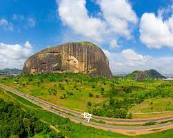 Zuma rock is a large monolith located in niger state, just north of abuja, along the main road from abuja, the capital of nigeria, to kaduna. Zuma Rock F27arts