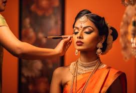 makeup artist applies young indian lady