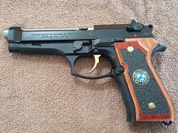 My tribute to Resident Evil a Beretta 92fs with custom grips from D S Grips  a new Stainless barrel, Gold plated trigger and Gold plated grip screws. :  r/residentevil