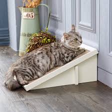 Shape strips of cardboard into a coil and secure with tape. Cat Scratcher Incline With Organic Catnip In White Way Basics