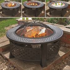 Featuring a 1 thick safety ring/handle, this fire pit can be easily carried along. Round Steel Firepit And Grill With Copper Coloured Bowl