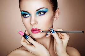 makeup artist applies lipstick stock
