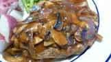 grilled salisbury steaks in savory mushroom gravy