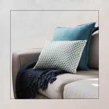 arrange throw pillows on a sectional sofa