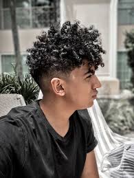 Long undercut hairstyles are a breezy way of blurring traditional sensibilities and infusing an aura of irreverent 'tude to your aesthetic! Undercut Curly Black Hair Men