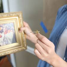 A single nail can likely do the trick and is easiest method if the frame comes with a hook or sawtooth hanger, says rachel rothman, chief technologist and director of engineering at the good housekeeping institute. How To Hang A Picture Lowe S