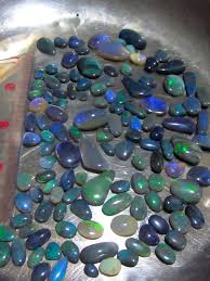 whole black opals about 120 natural