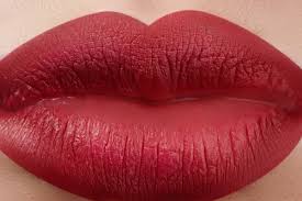 female lips with bright makeup macro