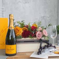 veuve clic with flowers simply her