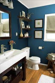 In a powder room, consider going darker and creating drama with a dark paint color or an unexpected wallpaper. Dark Blue Bathroom Ideas Best Bathroom Paint Colors Small Bathroom Remodel Amazing Bathrooms