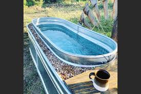 Using a simple propane outdoor water heater from amazon, you can turn your stock tank pool into a hot tub or heated pool in an afternoon. Move Over Elsie Never Mind The Livestock Make Yourself A Hot Tub Out Of A Stock Tank