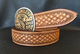 Leather carving freehand designs into wet and cased vegetable tanned just a high speed video of tooling a leather belt with a floral carved pattern. Custom Leather Products Weatherford Tx