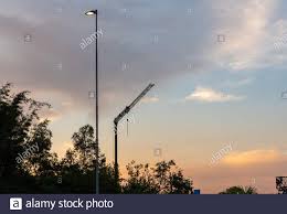 A Power Pole With Light On Cesa And The Silhouette Of A