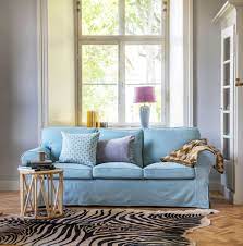 A solution for interior designers, architects and property developers. Baby Blue Light Blue Sofa With A Faux Zebra Skin Rug Vintage Rattan Side Table Seen Here An Ikea Ektorp 3 Seater Ikea Ektorp Sofa Ektorp Sofa Ikea Sofa