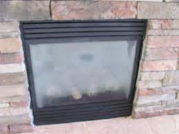 fogged glass gas fireplace inspecting