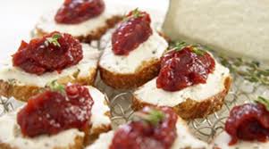 In a high powered blender or stand mixer, combine the goat cheese, cream cheese, and garlic powder. Crostini Of Goat Cheese And Tomato Jam Recipe