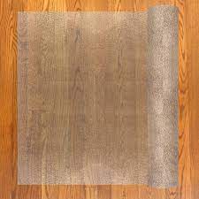 Patterned top surface provides traction underfoot while gripper back keeps the runner in place on low pile carpeting. Resilia Deluxe Clear Vinyl Plastic Floor Runner Protector For Hardwood Floors Skid Resistant Textured Pattern 27 Inches Wide X 6 Feet Long Kitchen Dining Amazon Com