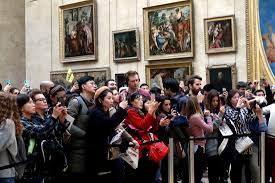 Mona Lisa zonder / met wenkbrauwen en wimpers - De Limburger Mobile
