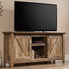 Please excuse our virginia accent. Sauder Dakota Pass Rustic Finish Credenza Tv Stand With Barn Doors Darvin Furniture Tv Stands