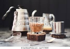 I saw a video on that once and it looked really interesting. Vietnamese Pour Over Coffee With Condensed Milk Maked In Phin On Dark Background Copy Space Canstock