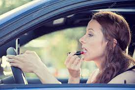 applying makeup while driving car