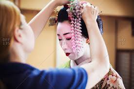 a geisha or maiko with a hair and make