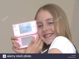 Maybe you would like to learn more about one of these?. Joven Chica Sujetando Una Consola De Juegos De Nintendo Ds Lite Uk Fotografia De Stock Alamy