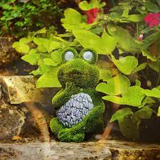 garden statue of frog with solar light