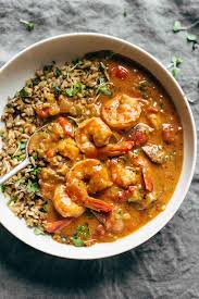 gumbo shrimp in a bowl with rice and a spoon