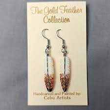 gold feather collection earrings hand