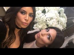 kim kardashian takes a selfie with her