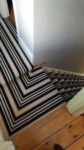 black white stripe carpet to stairs
