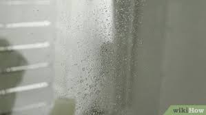 remove hard water stains from glass