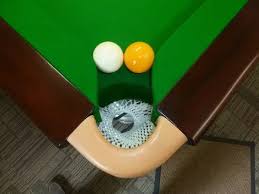 Not everyone knows that hitting a numbered ball off the table not only constitutes a scratch but that the projectile ball is placed on the table at the foul mark in casual bar pool, i have seen players just play a ball where it lands, even if this foul has occurred. What Happens When The Black Ball And The White Ball Get Wedged In The Hole Together In Pool When No Colours Remain On The Table Who Wins Loses Quora