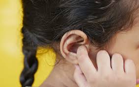 pimple in ear symptoms causes